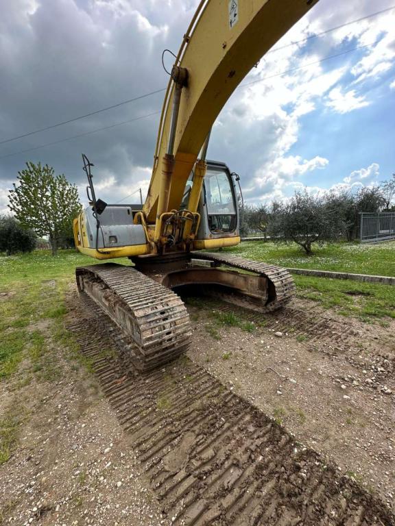 New Holland 305 Photo 7