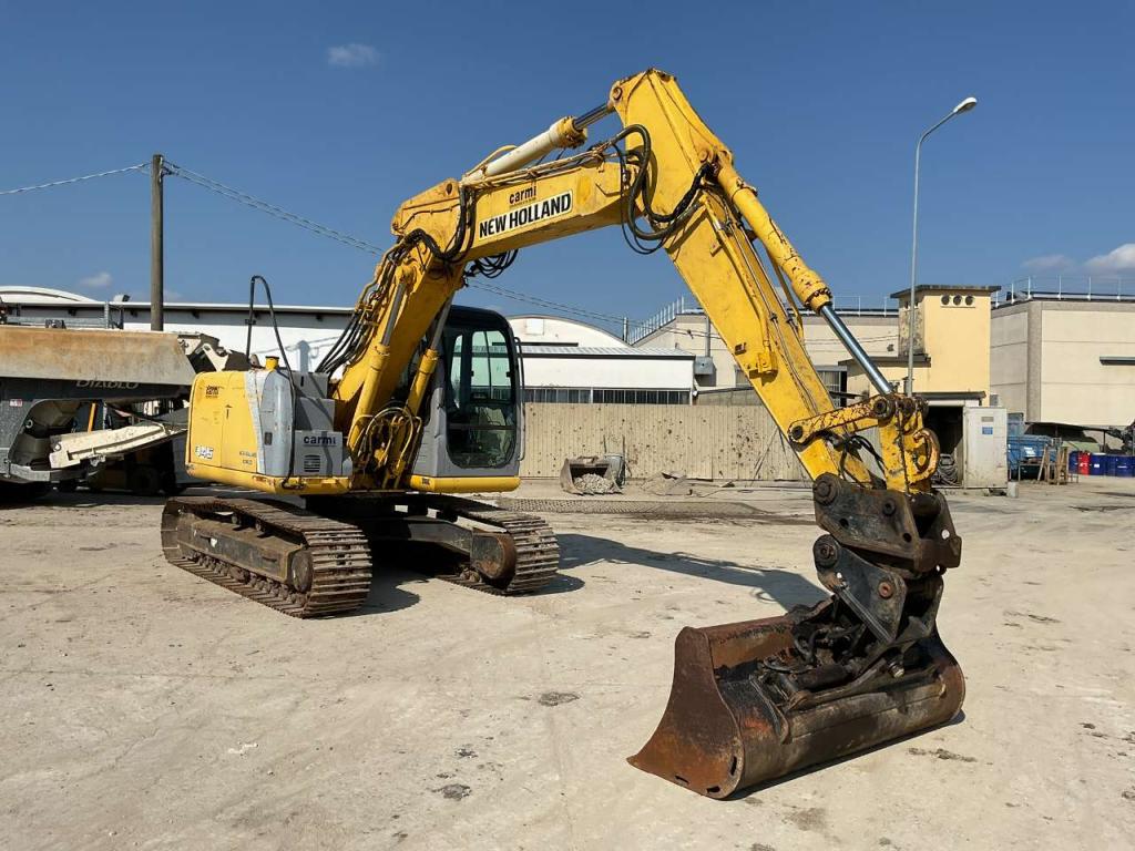 New Holland E145 Photo 1